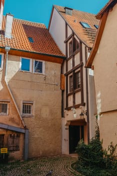 Old national German town house. Old Town is full of colorful and well preserved buildings. Baden-Wurttemberg is a state in southwest Germany bordering France and Switzerland. The Black Forest, known for its evergreen scenery and traditional villages, lies in the mountainous southwest. Stuttgart, the capital, is home to Wilhelma, a royal estate turned zoo and gardens. Porsche and Mercedes-Benz have headquarters and museums there. The 19th-century Hohenzollern Castle sits in the Swabian Alps to the south.