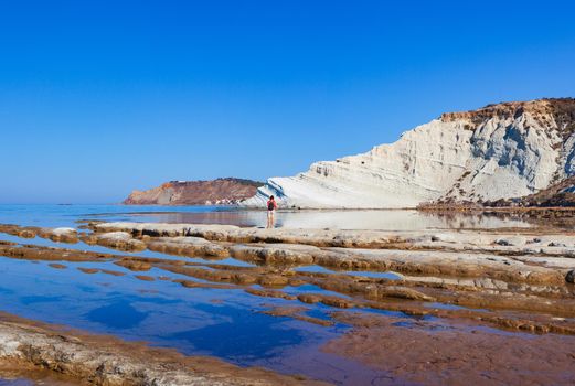 View of the limestone white cliffs with beach at the Scala dei Turchi in English Stair of the Turks near Realmonte in Agrigento province. Sicily, Italy