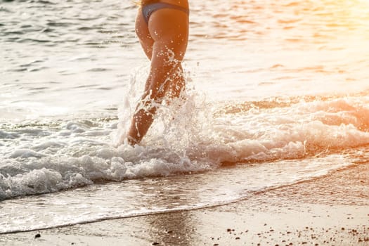 Running woman. Female runner jogging during the sunrise on beach. Woman Runner feet running on the beach at sunrise. woman fitness sunrise jog workout wellness concept.