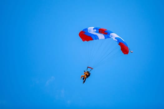 Jump in tandem skydivers-athletes with a parachute. High quality photo. Kirzhach Russia July 22, 2023
