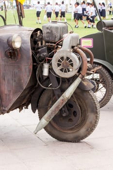 Vintage car engine on the front wheel.