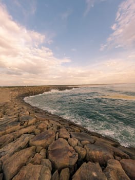 View south of Furadouro beach in Ovar on a stormy day at sunset.