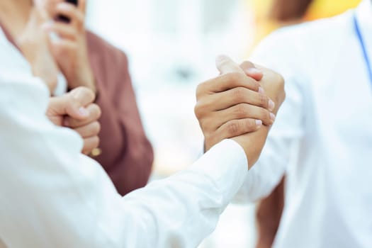 Closeup Handshake of employees after successful planning strategy marketing in the office.