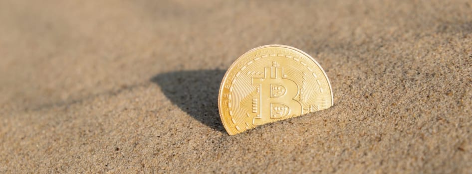 Bitcoin Coin cryptocurrency In Sand On Beach. Freelance, stock exchange BTC sign Concept mining bitcoin for holidays and vacation. Payment For Nature And Unlimited Possibilities. Copy Space Worldwide digital money and stock business