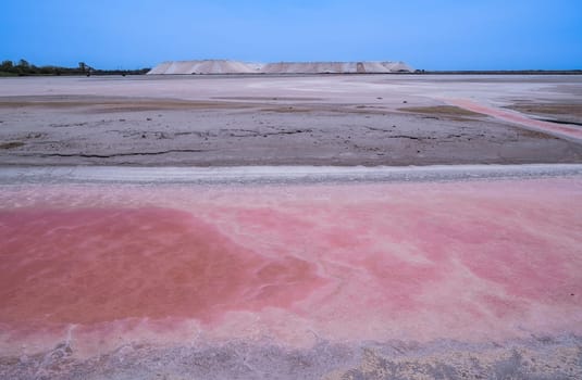 Pink Ponds In Man-made Salt Evaporation Pans In Camargue, Salin de Guiraud, France. High quality photo