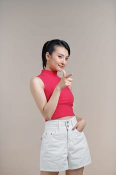 Young beautiful girl smiling happy pointing with hand and finger to the side