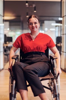 A modern young businesswoman in a wheelchair is surrounded by an inclusive workspace with glass-walled offices, embodying determination and innovation in the business world.