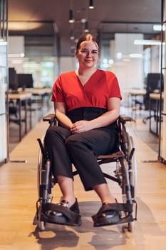 A modern young businesswoman in a wheelchair is surrounded by an inclusive workspace with glass-walled offices, embodying determination and innovation in the business world.