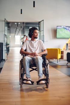 A businessman in a wheelchair occupies a hallway within a modern startup coworking center, embodying inclusivity and determination in the business environment.