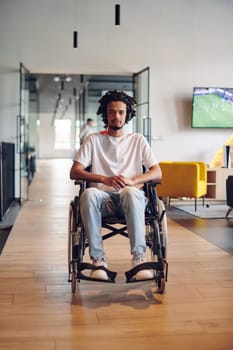 A businessman in a wheelchair occupies a hallway within a modern startup coworking center, embodying inclusivity and determination in the business environment.