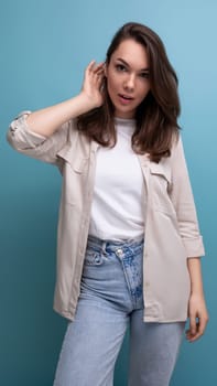 charming young brunette female adult in casual shirt.