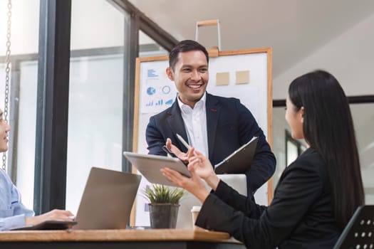 Close up of businesswoman presenting data analysis on board to her boss in company.