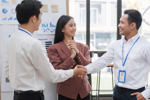 Professional businessmen shake hands to congratulate after business success..