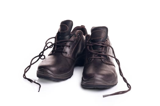 Pair of walking brown hiking boots, isolate on a white background