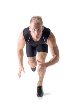 A man in a black shirt is doing a jump or sprinting for a run or race