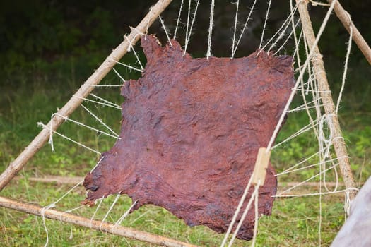 Leather drying on a wooden frame at a Viking festival in Denmark.