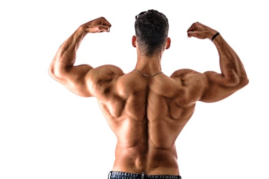 A man flexing his muscles in front of a white background