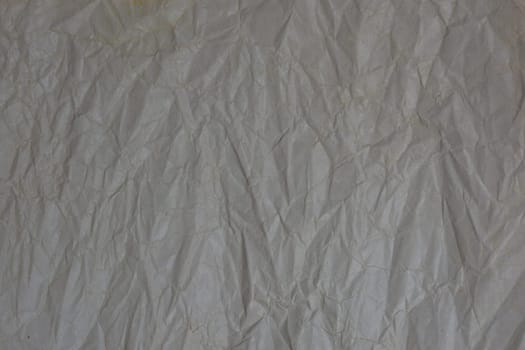 Horizontal dark background from crumpled paper. Recycled paper. Backdrop