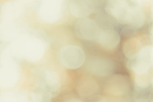 Beautiful large bokeh on a softly blurred background in beige tones. Abstraction. Backdrop