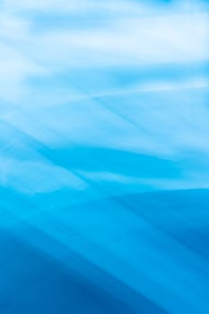 Blue vertical abstract background banner with wave lines crossing and soft gradient. Backdrop