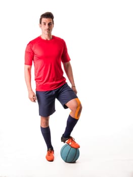 A man in a red shirt is standing next to a blue ball