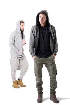 Two seemingly dangerous thugs standing next to each other in front of a white background