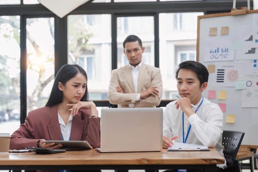 Group of business people working together and solving the problem of working stress in the meeting room at the office..