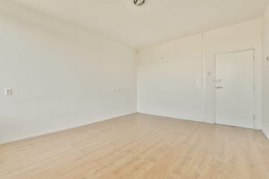 an empty room with white walls and wood flooring the room is clean and ready to be used for storage