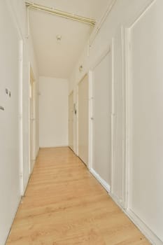 an empty room with white walls and wood flooring on either side of the room, there is no doors
