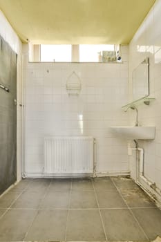 a bathroom that is in need of reurrectionment, with the toilet and sink on the floor