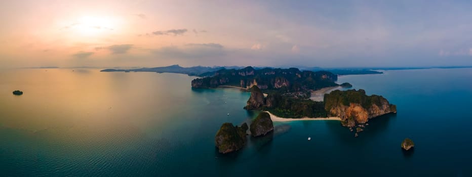 Railay Beach Krabi Thailand, the tropical beach of Railay Krabi, view from a drone of idyllic Railay Beach in Thailand in the evening at sunset with a cloudy sky. Panorama of Railay Beach