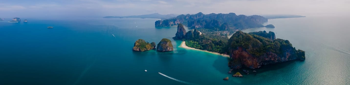 Railay Beach Krabi Thailand, the tropical beach of Railay Krabi, view from a drone of idyllic Railay Beach in Thailand at sunset. Panorama banner of beach