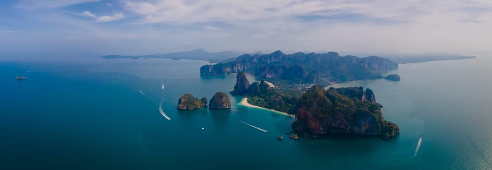 Railay Beach Krabi Thailand,drone view from above at the idyllic Railay Beach in Thailand in the evening at sunset with a cloudy sky
