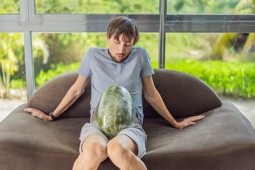 A humorous image: a pregnant woman and her husband playfully use a watermelon in place of a belly, comically highlighting the challenges of navigating with a pregnant bump.