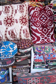 Colourful cushions on display for sale in a traditional Turkish Bazaar