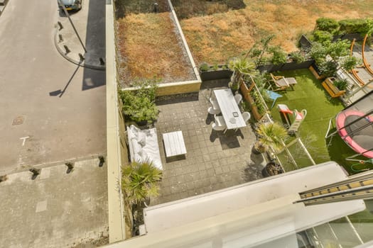 an aerial view from the roof of a house with a car parked on the street in front of the house