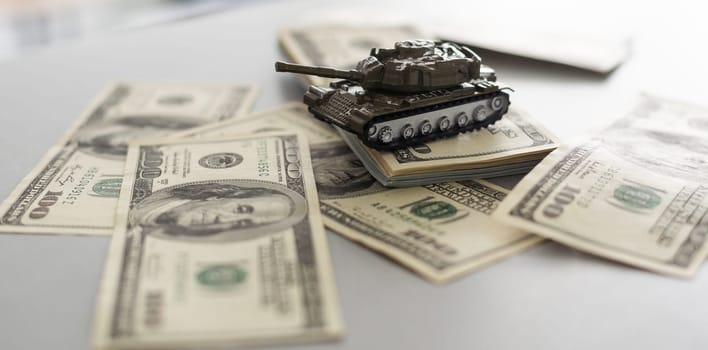 tank against the background of dollars. Concept of war. High quality photo