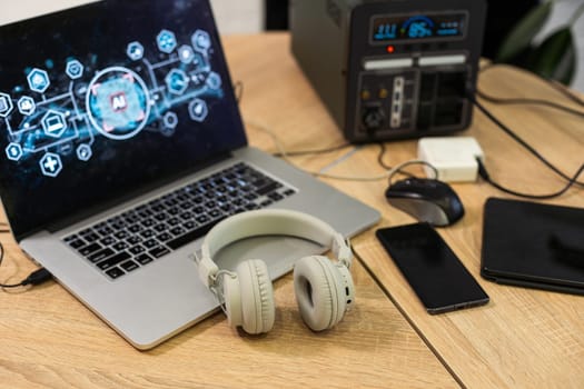 the laptop with the headset on the table at home. High quality photo