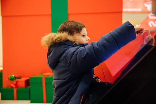 boy using interaction information panel in city