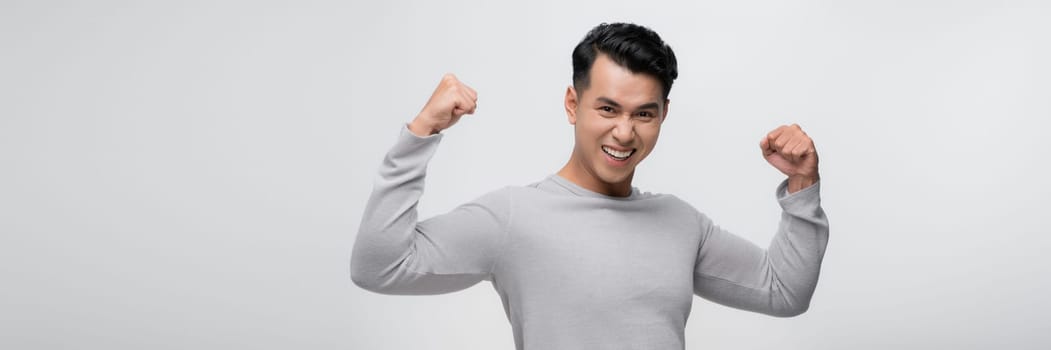 Asian male portrait posing on gray background