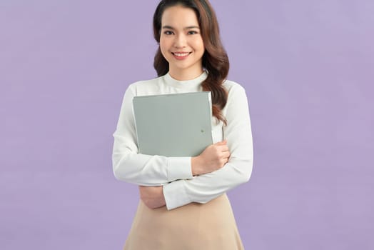 Retro asian business woman smiling and holding document binders