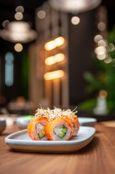 Classic Philadelphia sushi roll set with salmon and cream cheese. Japanese dish of fresh salmon and rice. High quality photo