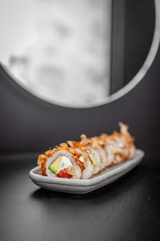 Classic Bonito sushi roll set with tuna flakes, salmon and avocado. Japanese dish of fresh salmon and rice. High quality photo