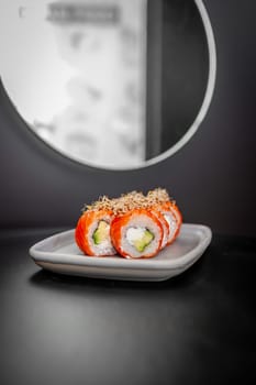 Classic Philadelphia sushi roll set with salmon and cream cheese. Japanese dish of fresh salmon and rice. High quality photo