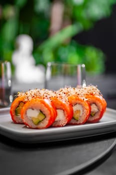 Classic Philadelphia sushi roll set with salmon and cream cheese. Japanese dish of fresh salmon and rice. High quality photo