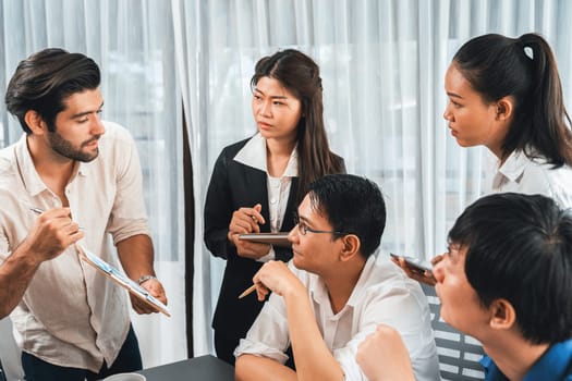 Group of diverse office worker employee working together on strategic business marketing planning in corporate office room. Positive teamwork in business workplace concept. Prudent