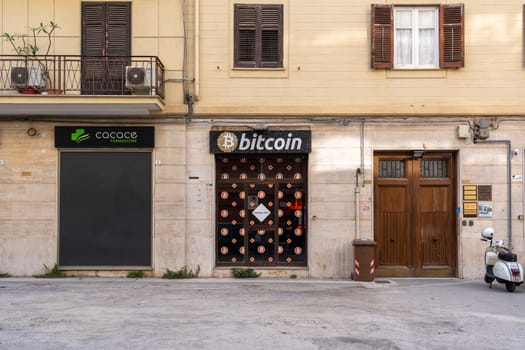 Palermo, Italy- July 22, 2023: Entrance door to a bitcoin ATM in the historic city center.