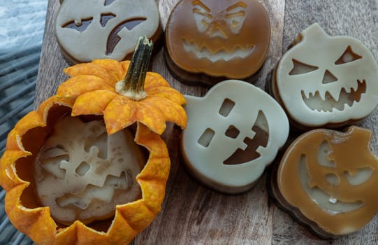 Delicious pumpkin ghost made with Agar powder and Halloween pumpkin. Tasty jelly in the shaped of cute ghost pumpkin. Celebrate with Halloween holiday, Pumpkin demon, Space for text, Top view, Selective focus.