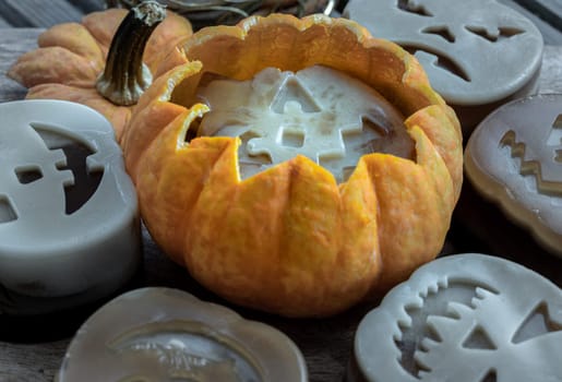 Delicious pumpkin ghost made with Agar powder in Halloween pumpkin. Tasty jelly in the shaped of cute ghost pumpkin. Celebrate with Halloween holiday, Pumpkin demon, Space for text, Selective focus.