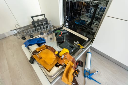 repairing a dishwasher with tools. High quality photo